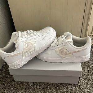 All white , gold, and tan Air Force ones with white shoe laces